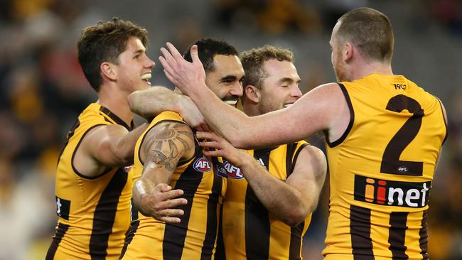 Hawthorn's Shaun Burgoyne celebrates his goal in the fourth quarter with Tom Mitchell , Jarryd Roughead and Ryan Burton. Picture: Michael Klein