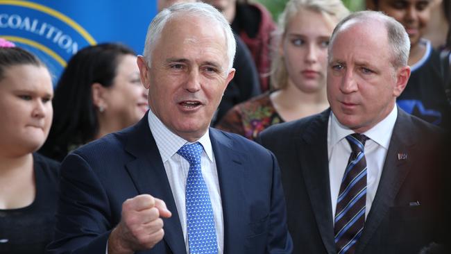 Opinion poll results deliver a significant boost to the LNP and suggest it will be almost impossible for Labor to win the seat of Petrie held by Luke Howarth (pictured with the PM). Picture: Lyndon Mechielsen