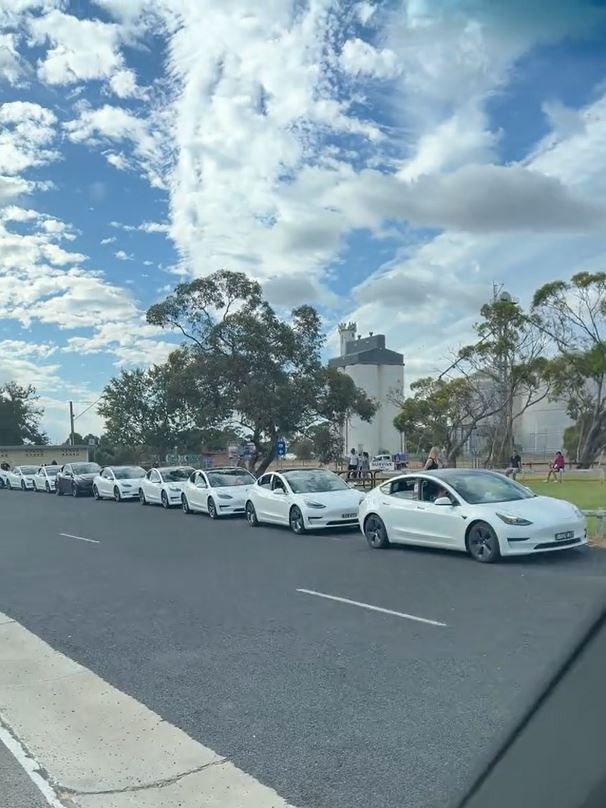 A screenshot of a clip showing a long queue of Teslas waiting for a charging station spot in Keith in rural South Australia. Picture: @pauylyohh83
