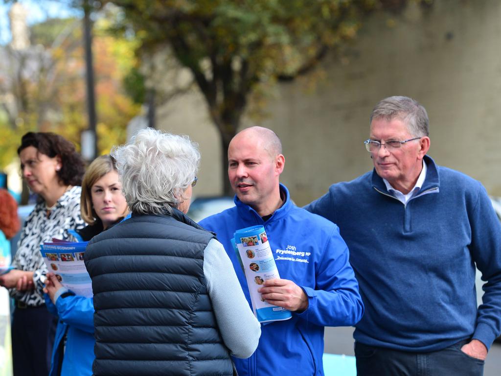 Australian Federal Treasurer Josh Frydenberg visits the pre-polling booth in Hawthorn, Melbourne, with former Premier of Victoria Ted Baillieu. Picture: NCA NewsWire / Nicki Connolly