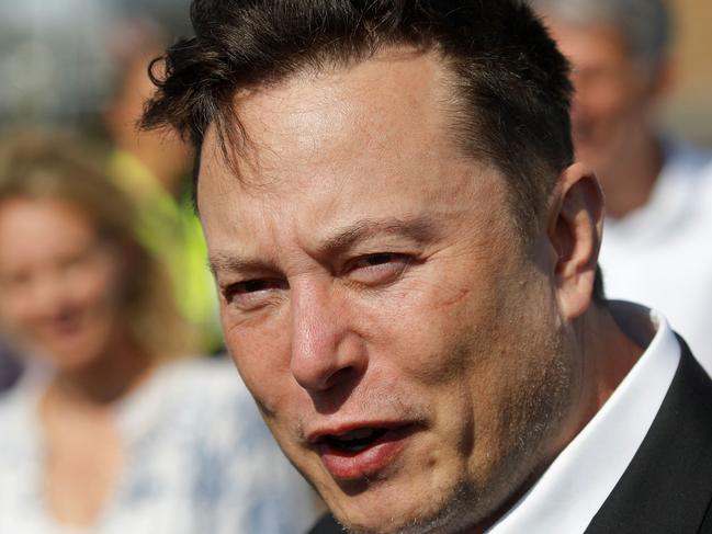 (FILES) In this file photo taken on September 3, 2020 Tesla CEO Elon Musk talks to media as he arrives to visit the construction site of the future US electric car giant Tesla, in Gruenheide near Berlin. - Musk changed his Twitter profile to "Chief Twit" and posted video of himself walking into the social network's California headquarters carrying a sink on October 26, 2022, days before his contentious takeover of the company must be finalized. The billionaire Tesla chief captioned the video "Entering Twitter HQ - let that sink in!" He also listed his location as Twitter headquarters in San Francisco. (Photo by Odd ANDERSEN / AFP)