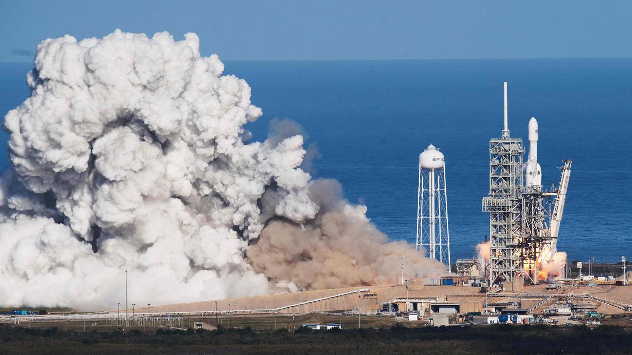 The SpaceX Falcon Heavy takes off from Kennedy Space Center in Florida, US, on February 6, 2018, carrying Elon Musk's cherry red Tesla roadster to an orbit near Mars. Picture: AFP