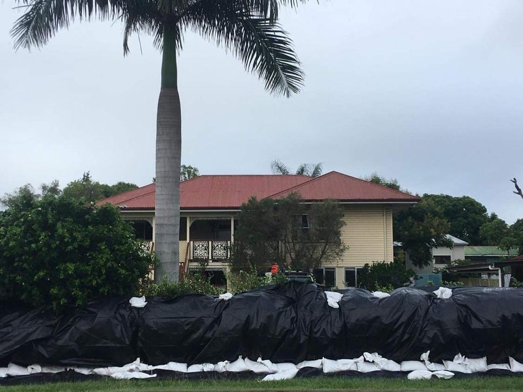 People at a Maryborough home have tried to erect their own levee to keep the floodwaters out.