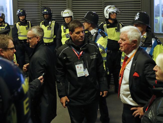 FC Cologne's President Werner Spinner (2nd R) speaks to officials outside the stadium