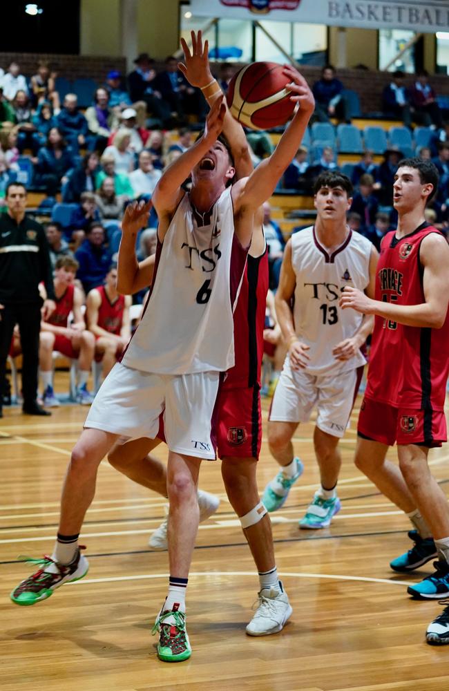 Paul Papacostas on the right, about to snatch a rebound. Pic: Heidi Brinsmead