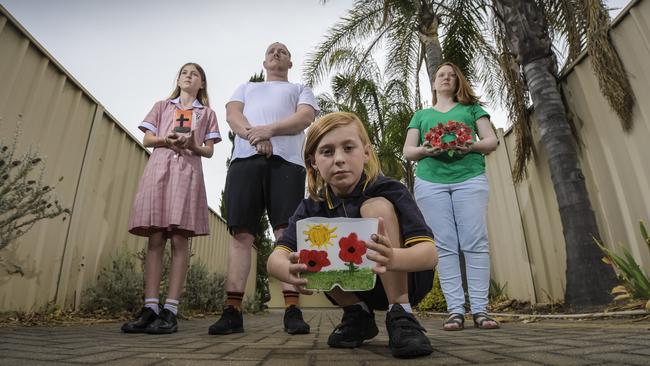 Jessica Kearney with partner Joshua Lister and children Alexis, 12, and Atlas, 9, will honour the Anzacs with a driveway vigil if marches are cancelled. Picture: Roy Van Der Vegt