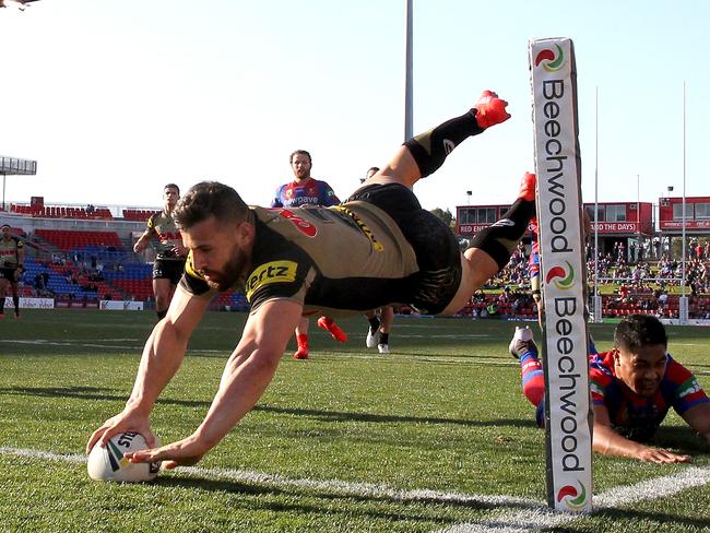 Josh Mansour scores a try against the Knights.