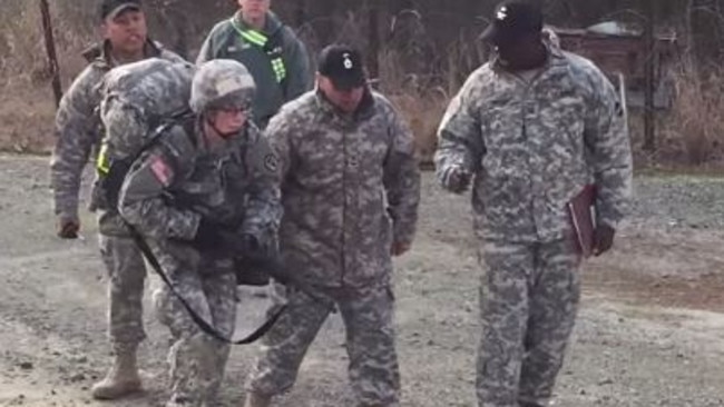 You go girl! Captain Sarah Cudd being cheered on as she completes the 12 Mile Foot March (20kms) the last event of the Expert Field Medical Badge. The march has to be completed in under three hours, which she did.