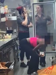 Screengrabs of the viral video, showing a woman taking food from the fridge.