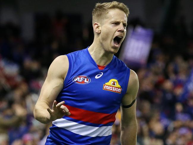 AFL Round 16. 07/07/2018. Western Bulldogs v Hawthorn at Etihad Stadium.  Western Bulldogs Lachie Hunter celebrates his goal in the first quarter  . Pic: Michael Klein