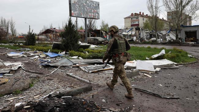 A Ukrainian serviceman walks down a street in the frontline city of Bakhmut. Picture: AFP