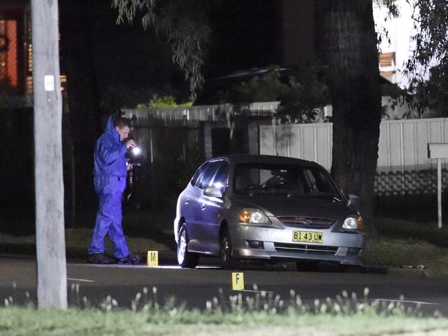 Forensic crews were examining the crime scene left in Matthew Street Heckenberg after a fatal shooting at around 6:30pm last night. Picture: Gordon McComiskie