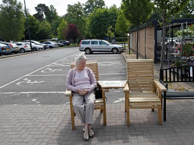 A customer sits on a garden seat outside a Garden centre in Bagshot, west of London. Picture: AFP