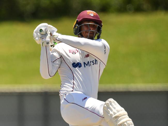 sheffield Shield match between Queensland Bulls and Tasmanian Tigers at Townsville's Riverway Stadium. Tigers Jake Doran watches as Queensland's Usman Khawaja smahses a six on the way to his 100.  Picture: Evan Morgan