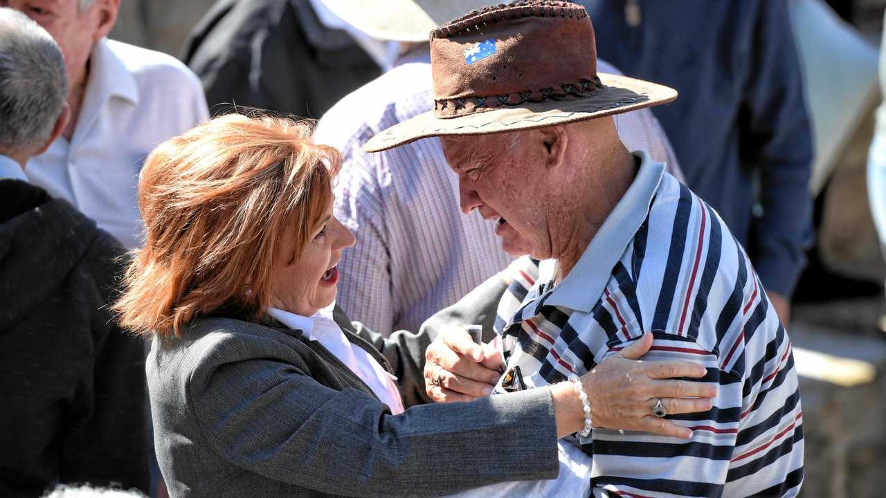 Bundamba MP Jo-Ann Miller comforts a man at the memorial service to commemorate the 47th anniversary of the Box Flat Mine disaster. Picture: Rob Williams