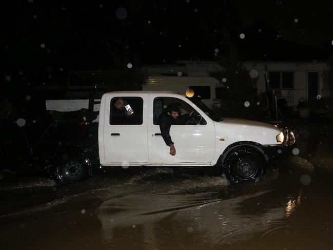 flooded Freeman Avenue, Canley vale.  heavy rain causes flooding across Sydney. Picture: John Appleyard