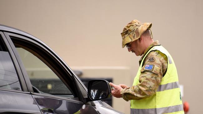 Police check cars at the Queensland border with NSW at Coolangatta. Picture: Steve Holland