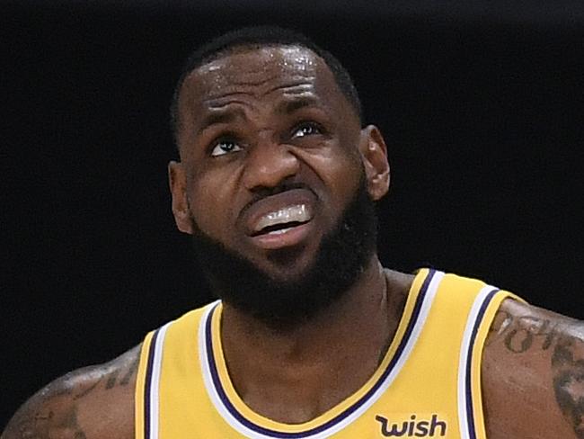 LOS ANGELES, CALIFORNIA - DECEMBER 22:  LeBron James #23 of the Los Angeles Lakers reacts as he looks up at a replay during a 116-109 LA Clippers win in the season opening game at Staples Center on December 22, 2020 in Los Angeles, California. NOTE TO USER: User expressly acknowledges and agrees that, by downloading and or using this photograph, User is consenting to the terms and conditions of the Getty Images License Agreement. (Photo by Harry How/Getty Images)