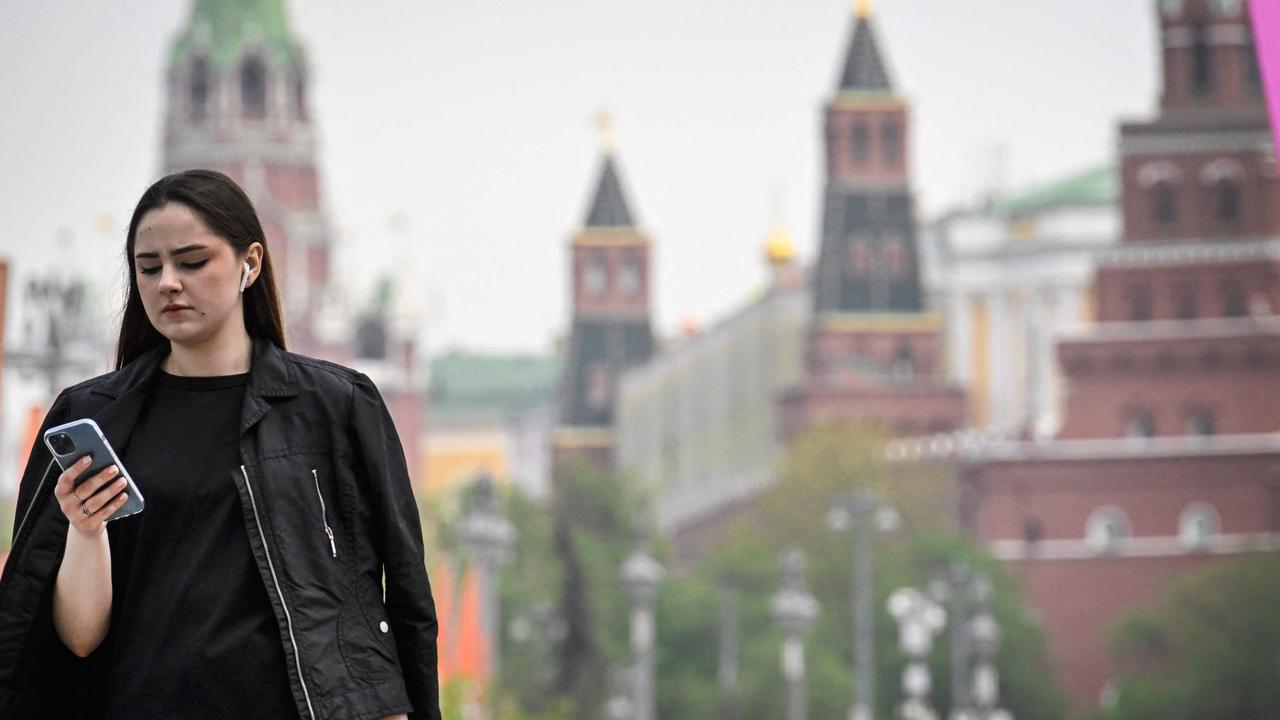 A woman walks in front of the Kremlin in Moscow last month. Picture: Alexander NEMENOV/AFP