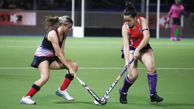 Zoe Van Drie and Carmen Haug contest the ball in the Cairns Hockey Women's A Grade match between South Cairns and Trinity Stingers. PICTURE: BRENDAN RADKE