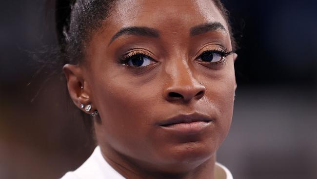 TOKYO, JAPAN - JULY 27: Simone Biles of Team United States looks on during the Women's Team Final on day four of the Tokyo 2020 Olympic Games at Ariake Gymnastics Centre on July 27, 2021 in Tokyo, Japan. (Photo by Laurence Griffiths/Getty Images)