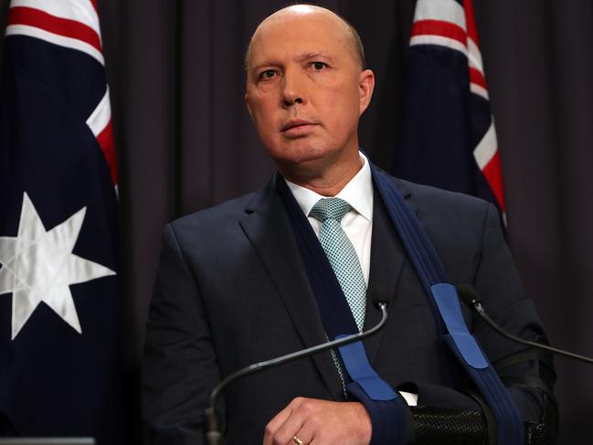 Home Affairs Minister Peter Dutton  holding a press conference at Parliament House in Canberra.