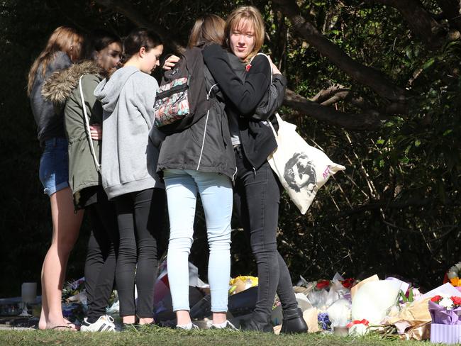 Friends, family and strangers continue to leave tributes outside the home of the siblings. Picture: John Grainger