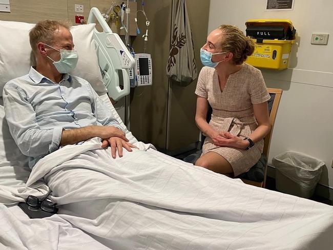 Richard Scolyer receives a visit from colleague Georgina Long while undergoing treatment for brain cancer. Picture: Supplied