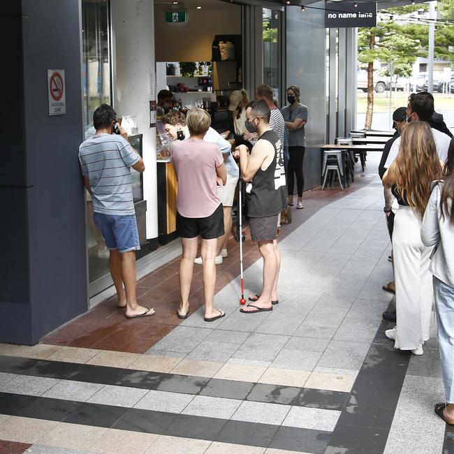 Day 2 in lockdown. Members of the public line up to get coffee in Broadbeach. Picture: Tertius Pickard