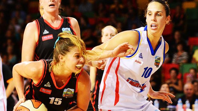 The Townsville Fire v Adelaide Lightning from RSL Stadium. Fire's Olivia Thompson is guarded by Lightning's Laura Hodges. Picture: Zak Simmonds