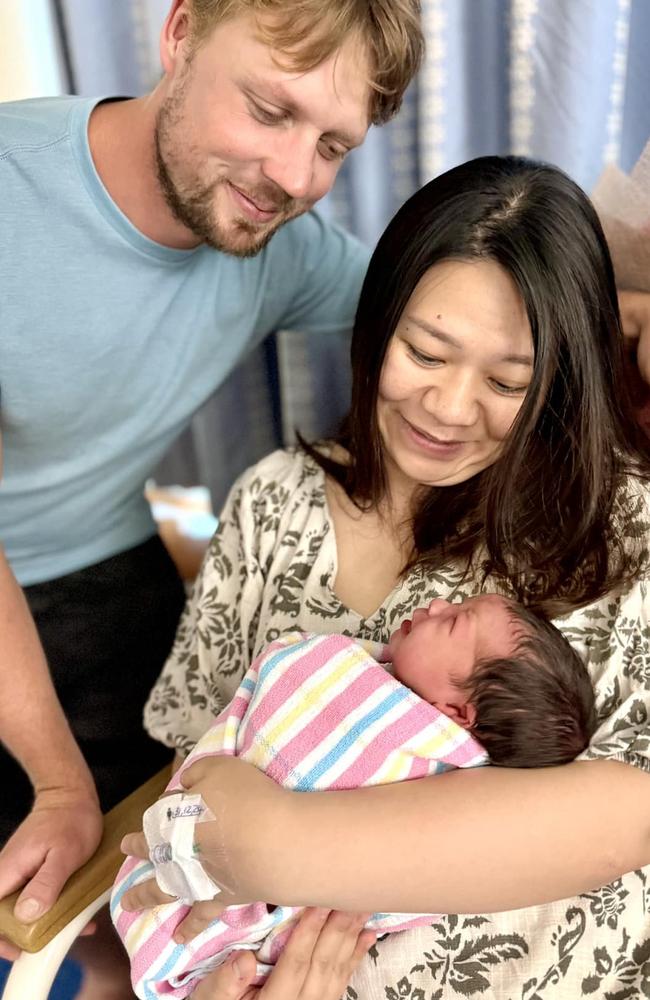 First-time parents Huang Tzu-Ling and Liam Walsh with their daughter Remi, born at Port Macquarie Hospital.