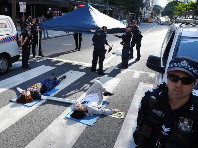 Sergio and Ebony protesting government inaction on climate change. Picture: Liam Kidston