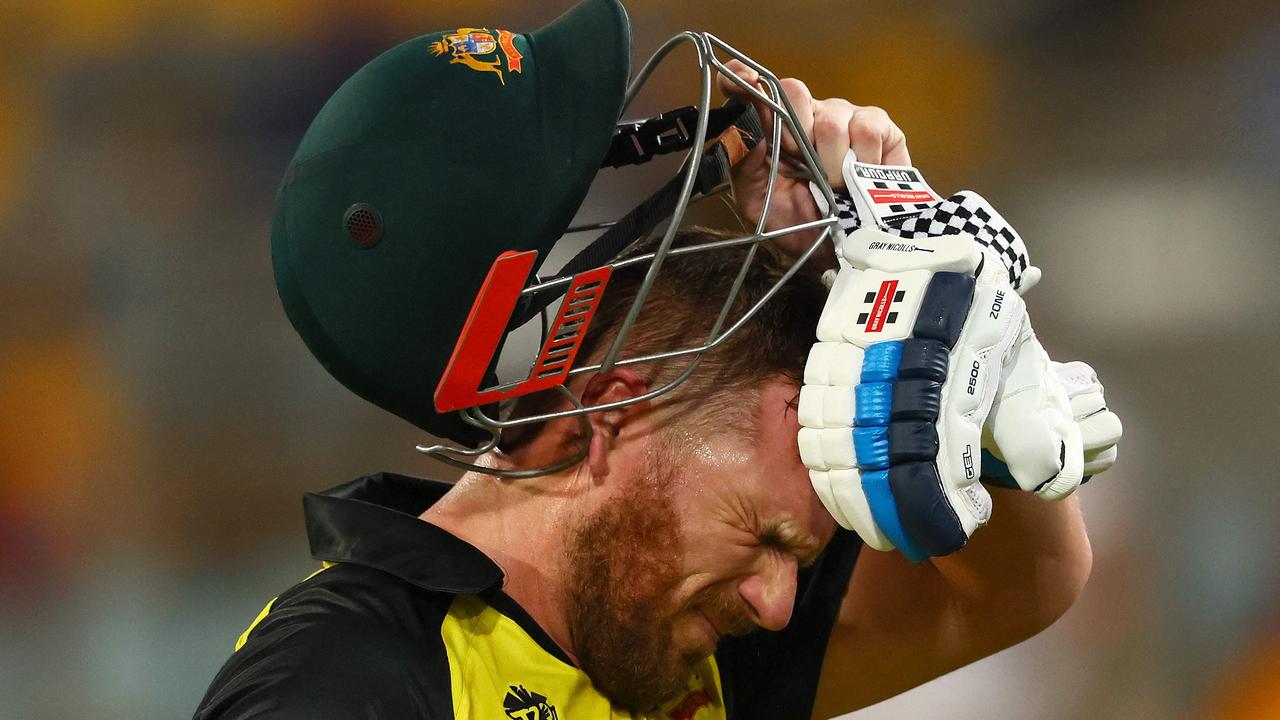 Aaron Finch hit his way out of a slump - but finished the match in the grandstand with a hamstring complaint. Picture: AFP