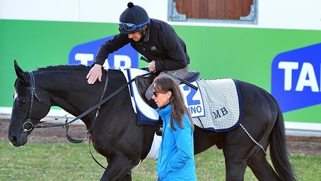 Paul Francis talks with Lucia Botti, the wife of trainer Marco, after riding Dandino.