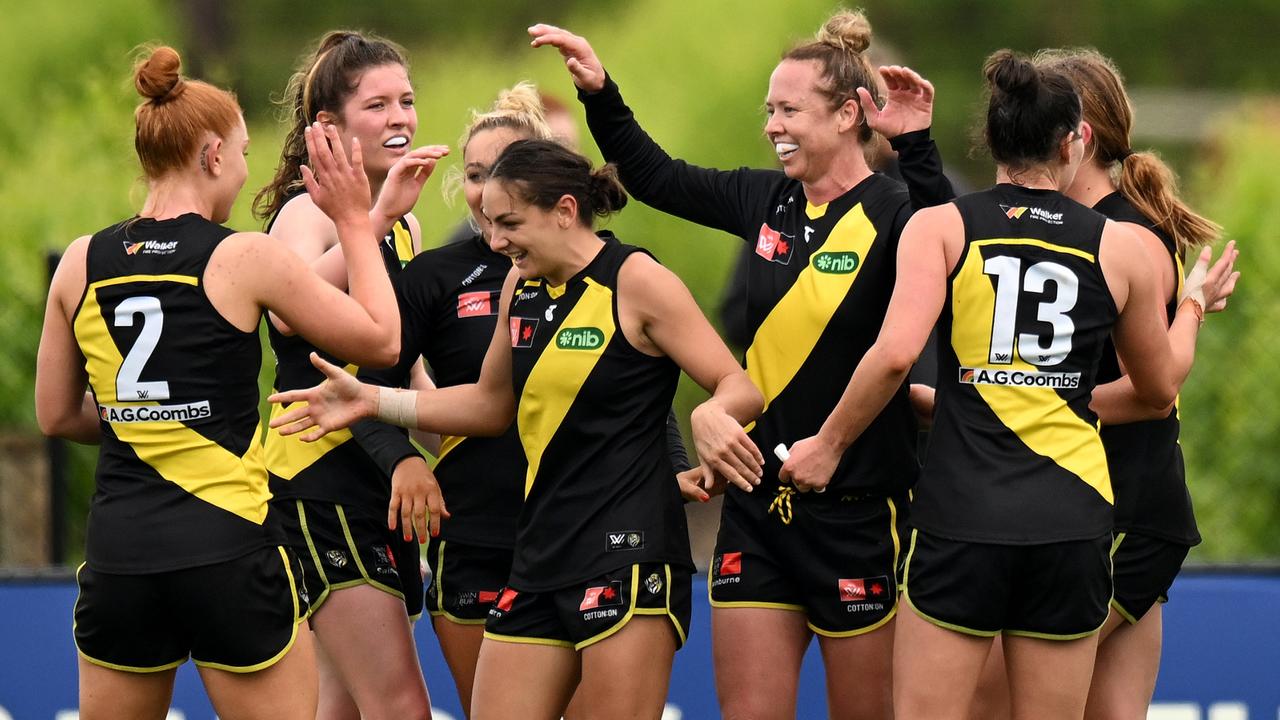 MILDURA, AUSTRALIA - OCTOBER 23: Tigers players celebrate after Monique Conti of the Tigers kicked a goal during the round nine AFLW match between the Richmond Tigers and the Greater Western Sydney Giants at Mildura Sporting Precinct on October 23, 2022 in Mildura, Australia. (Photo by Morgan Hancock/AFL Photos/via Getty Images)