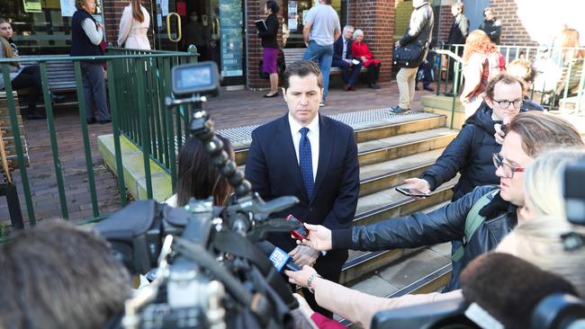 Phelan and his lawyer speak to reporters outside court. Picture: John Grainger