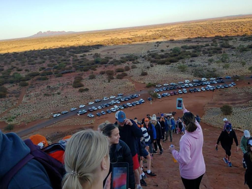 Tourists snap pictures of themselves and the car park below. Picture: @koki_mel_aus