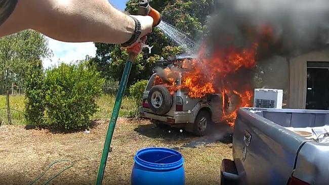 Police officers from Brisbane attached to Operation Whiskey Legion have helped put out a car fire in Tolga. Picture: Queensland Police Service