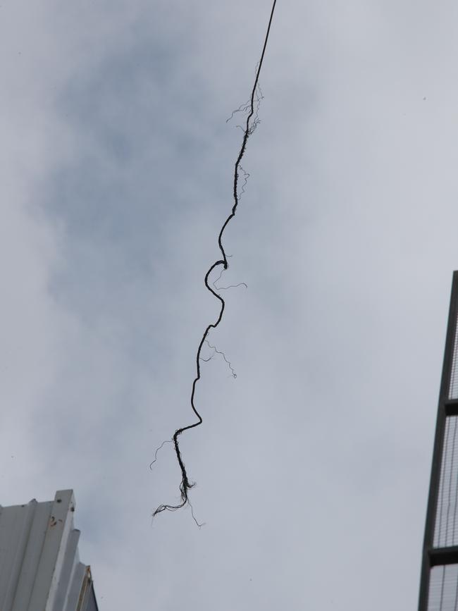 A frayed cable swings from the crane. Picture Glenn Hampson