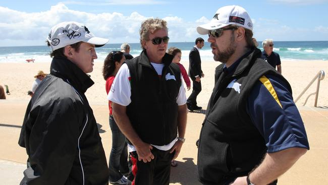 Mr Alcott (centre) with then-Souths coach Jason Taylor and club owner Russell Crowe at Maroubra Beach.