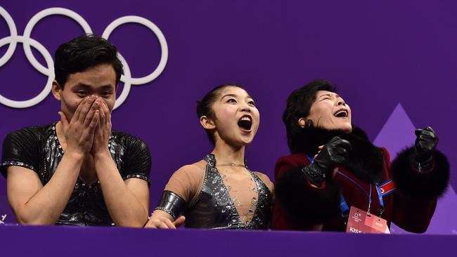 North Korea's Ryom Tae Ok and Kim Ju Sik react after their pairs figure skating routine. Picture: AFP