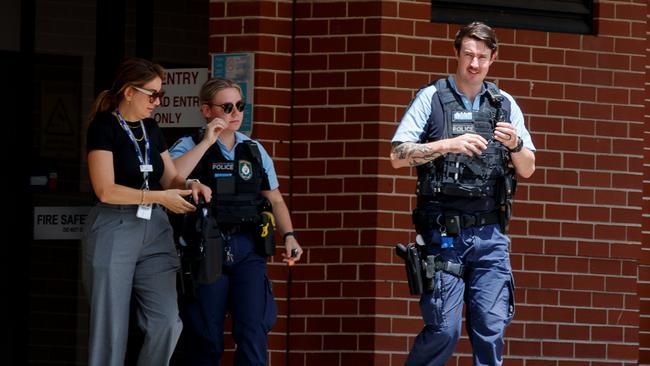 Police leave Bankstown Hospital on Wednesday after the two nurses were stood down. Picture: Nikki Short