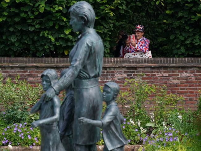 Members of the public view the statue of Diana, Princess of Wales, in the Sunken Garden at Kensington Palace. Picture: Jonathan Brady-WPA Pool/Getty Images