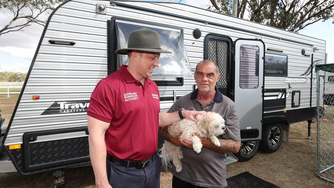 Acting Premier Steven Miles in Tara with Colin Chisnall and dog Brocky in the caravans donated by govt.at the Showgrounds Pic Annette Dew.