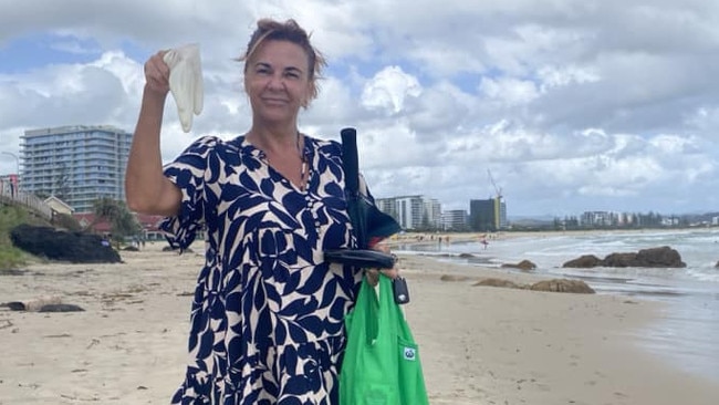 Kath Down, pictured with the debris on Kirra Beach. Picture: Save Our Southern Gold Coast