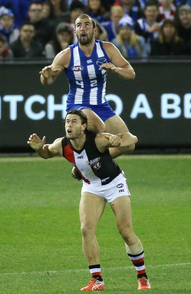 Ben Cunnington takes a hanger over Mav Weller in the second quarter. Picture: George Salpigtidis