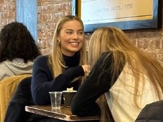 This photo of Margot Robbie having a coffee with author Sarah J Maas has sent fans into a frenzy. Picture: Instagram