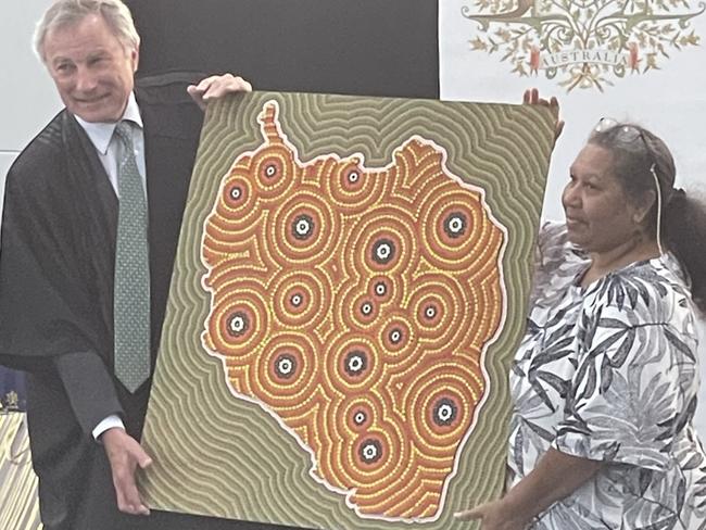 Justice Steven Rares was presented with a traditional artwork by Aunty Lois Johnson painted by Gilbert Laurie. Justice Rares told the assembly the artwork would be displayed in a prominent spot at the Federal Court.