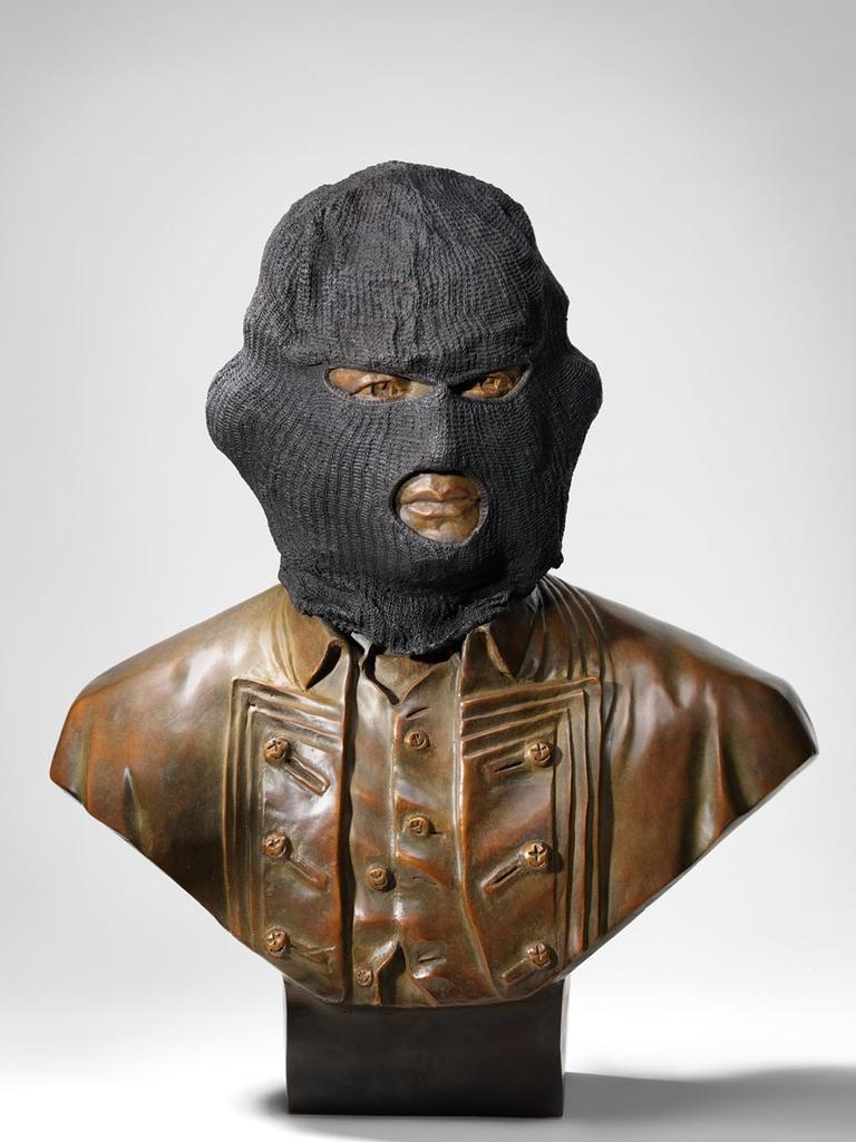 A controversial bust of James Cook draped in a bronze balaclava. The bust was created by Jason Wing, a Sydney artist of Aboriginal and Chinese heritage, and was purchased in 2013 by the National Gallery of Australia.