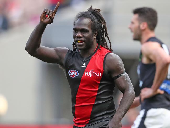 MELBOURNE, AUSTRALIA - AUGUST 27: Anthony McDonald-Tipungwuti of the Bombers celebrates after kicking a goal during the round 23 AFL match between the Essendon Bombers and the Carlton Blues at Melbourne Cricket Ground on August 27, 2016 in Melbourne, Australia. (Photo by Scott Barbour/Getty Images)